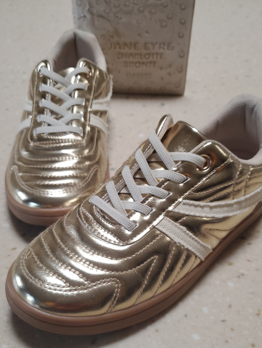 Steve Madden Metallic Gold Low-Top Sneakers with White Trim